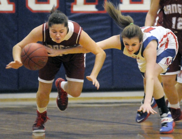 Messalonskee High School’s Makayla Wilson, right, pushes the ball away from Bangor High School’s Emily Gilmore during a game Tuesday in Oakland.