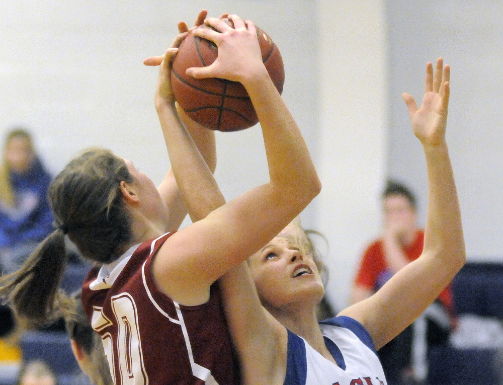 Messalonskee High School’s Sophia Holmes, right, strips Bangor High School’s Emily Gilmore of the ball during a game Tuesday in Oakland.