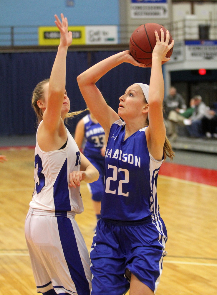 Madison Area Memorial High School’s Aishah Malloy tries to shoot over Mountain Valley High School’s Abby Parent during the second half of Saturday’s opening game at the annual Capital City Hoop Classic at the Augusta Civic Center. Madison lost 60-29.