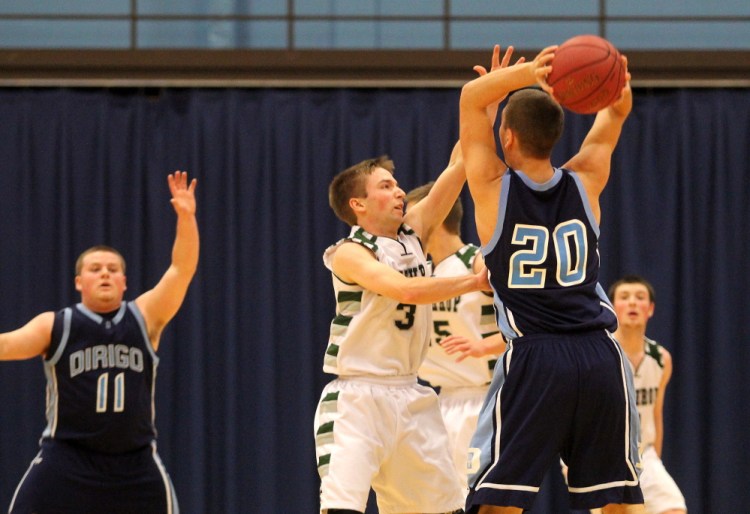 Winthrop High School’s Taylor Morang puts pressure on Dirigo High School’s Riley Robinson during first half action at the Capital City Hoop Classic at the Augusta Civic Center on Saturday.
