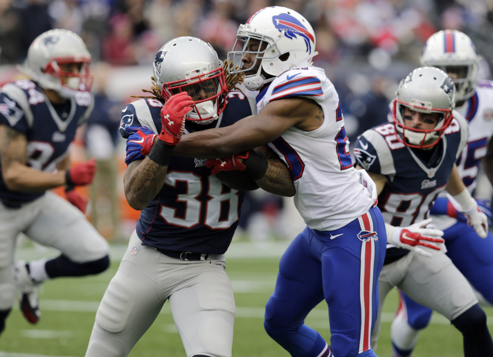 Buffalo Bills cornerback Corey Graham, right, stops New England Patriots running back Brandon Bolden in the first half Sunday in Foxborough, Mass.