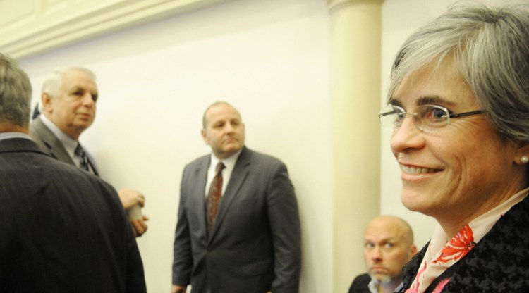 Democrat Cathy Breen enters the Legislative Council Chambers in Augusta on Tuesday to attend a hearing on contested ballots in Senate District 25 race. In the end Tuesday, she emerged as the winner.