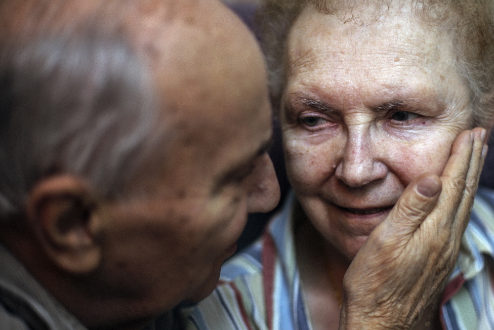 John Pochebit is now caring for his wife, Mary Carol, 81, at home in Portland partly because of new patient care practices. Her doctors collaborated to take her off unnecessary medication, and her health improved enough to allow her to leave a nursing home and live semi-independently. Whitney Hayward/Staff Photographer