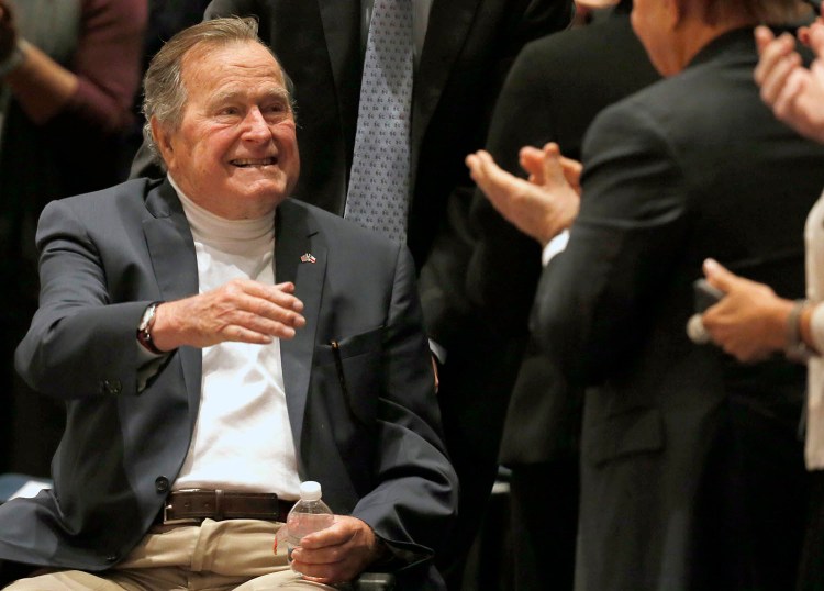 Former President George H.W. Bush acknowledges the crowd at his presidential library in College Station, Texas, on Nov. 11, 2014.