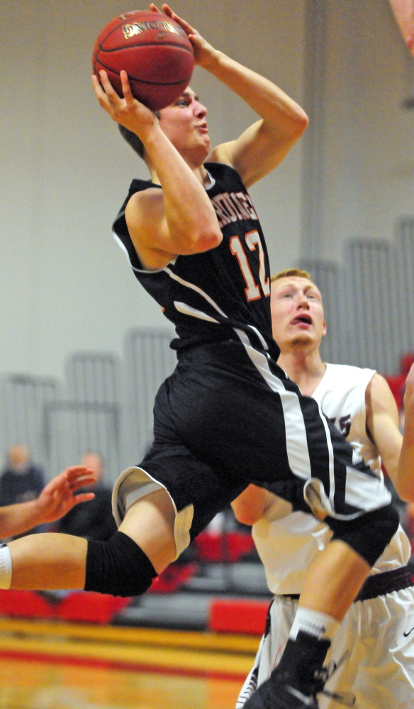 Staff file photo by Joe Phelan 
 Gardiner forward Seth McFarland goes up for a shot during the annual Chrisanne Burns Memorial tournament in November. McFarland is a big reason why the Tigers are enjoying a standout season.