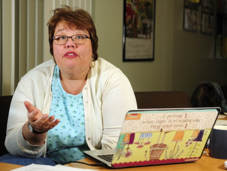Simonne M. Maline, executive director of the Consumer Council System of Maine, answers questions during an interview on Friday in her Augusta office.