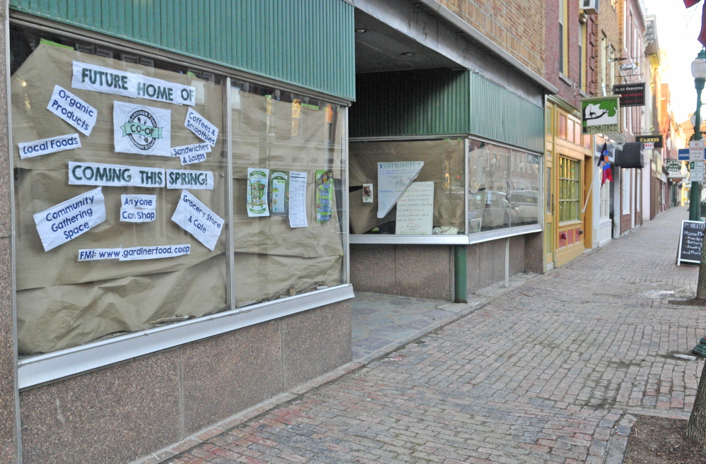 Renovation proceeds Tuesday behind the paper-covered windows in the space that will become the Gardiner Food Co-op & Cafe on Water Street in downtown Gardiner.