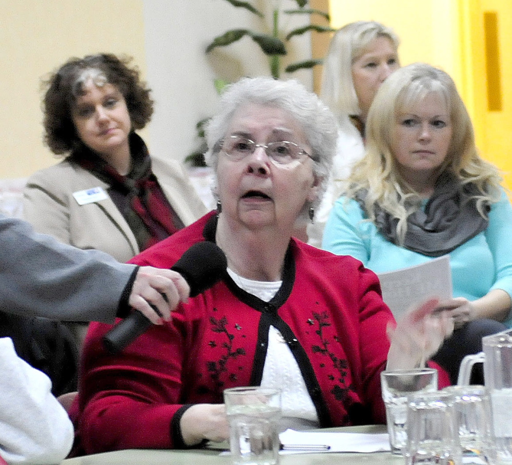 Shirley Aube speaks on Tuesday at the Muskie Center in Waterville. At right is Sue Roy, executive director of Waterville Hospice.