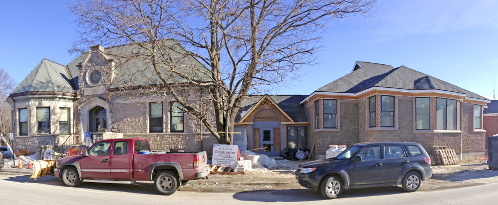 The original Charles M. Bailey Public Library, left, and the new addition that’s being finished on time and within budget, according to library officials.