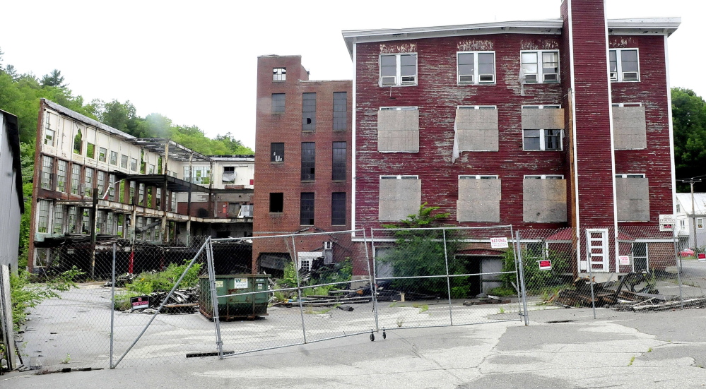 The former Forster mill in Wilton has been deemed a dangerous eyesore by town officials. The owner, who is being sued by the town to tear the building down, has filed for personal bankruptcy.