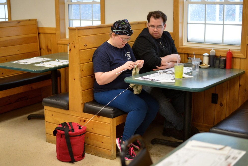 Kristi Trafton, 24, of Oakland, crotchets on Tuesday as she waits for her breakfast to be served with George Gehrling, 28, also of Oakland, at the Early Bird Restaurant in Oakland.
