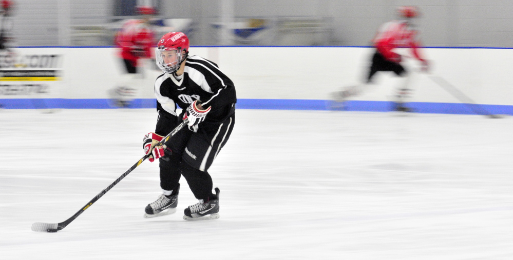 Staff photo by Joe Phelan 
 The Cony/Monmouth hockey team held an optional practice Friday at the Bank of Maine Ice Vault in Hallowell. The recent storms have wreaked havoc with the high school sports schedule.