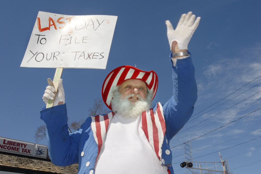 Adolph Kiper courts tax preparation customers in 2009. He is accused of terrorizing his neighbor, but his attorney says Kiper’s mental and physical disabilities make that impossible. Jack Milton/2009 Press Herald file