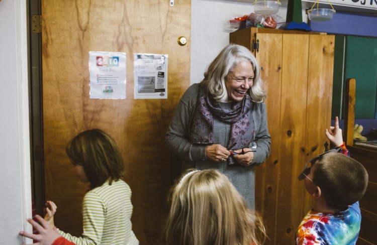 Teacher Nancie Atwell mingles Tuesday as recess ends and students head to the rest of the day’s classes at the Center for Teaching and Learning, which she founded in the coastal town of Edgecomb. Atwell says teaching is “pure pleasure. It’s like eating dessert all day long.” Whitney Hayward/Staff Photographer