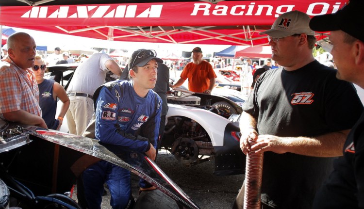 Race driver Austin Theriault, center, will drive in 13 of the 23 races in the NASCAR Camping World Truck Series.