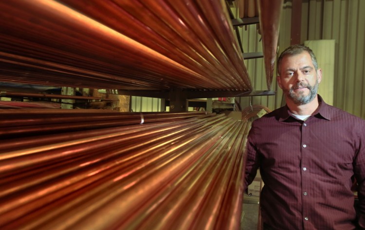 Nate Bassett, a plumbing supplier, says copper costs are down 12 percent since August. Gregory Rec/Staff Photographer