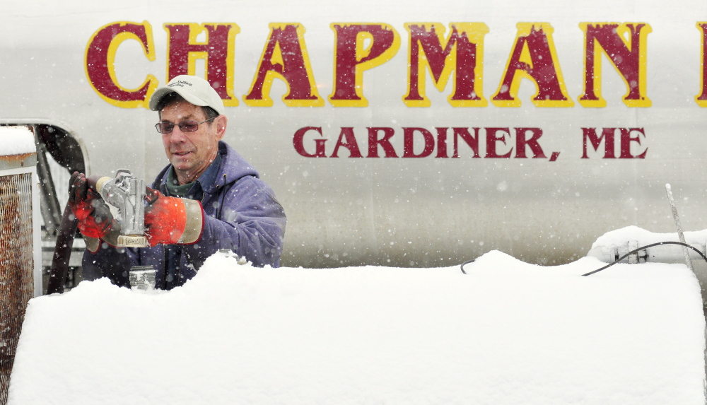Danny Chapman delivers fuel to Fuller’s Market on Friday in West Gardiner.