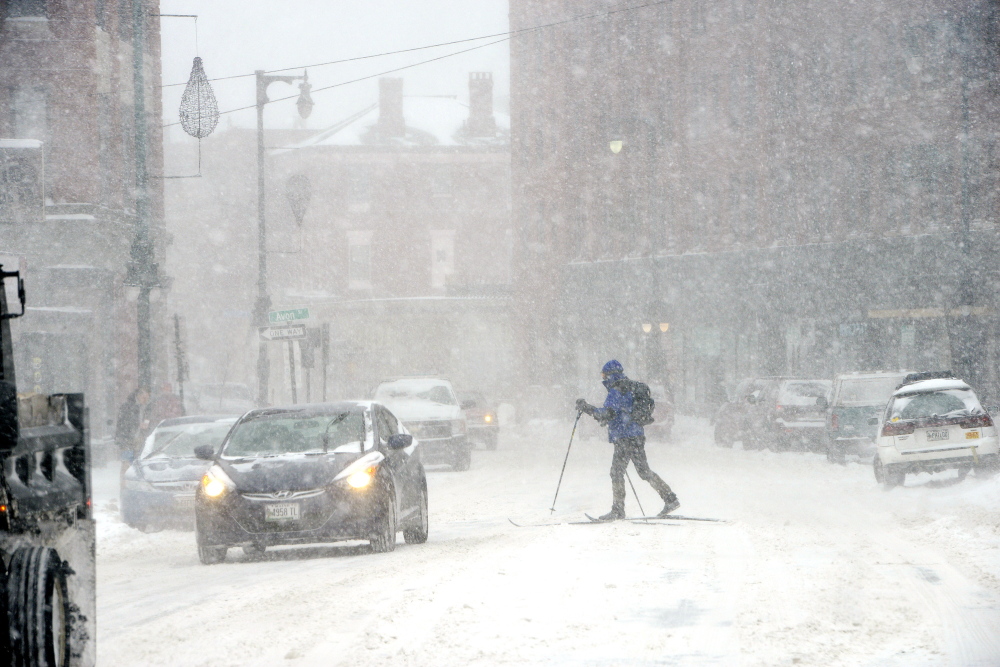 A cross-country skier finds traveling along Congress Street a bit more fun than sliding around in a car as Portland residents coped with the latest snowstorm to hit Maine.