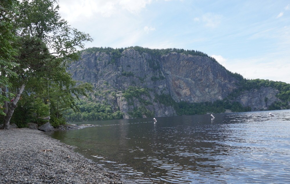 The east face of Mount Kineo as seen last summer from Pebble Beach on the Mount Kineo peninsula in Moosehead Lake. A snowmobiler died in an accident on a trail on the mountain Saturday.
