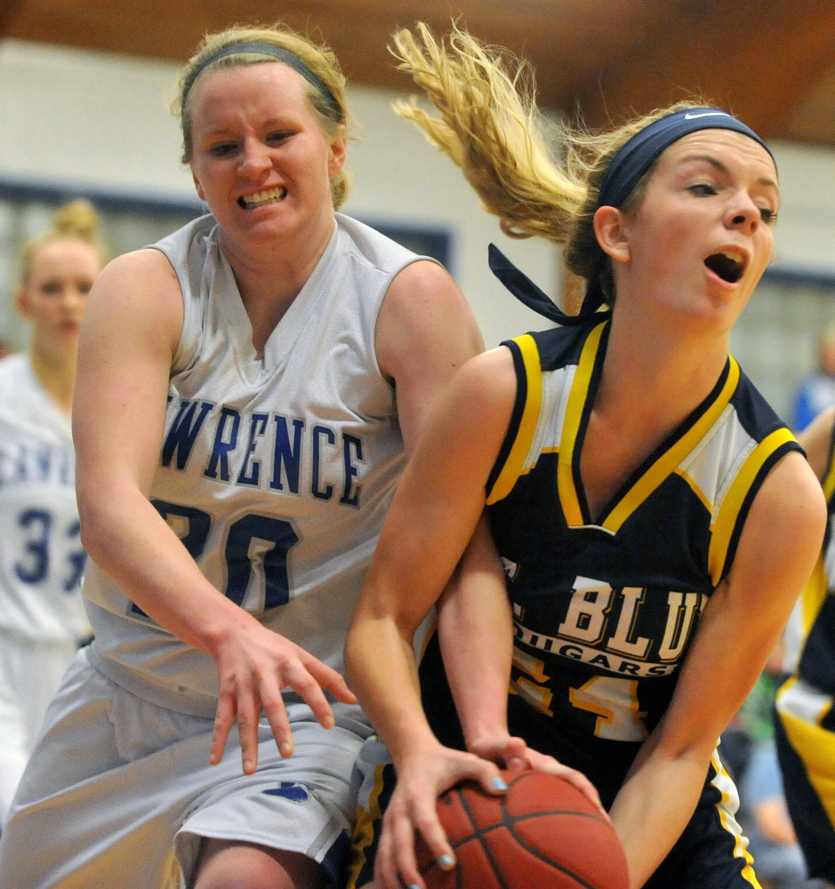 Lawrence High School’s Jordyn Towers, left, battles for the rebound with Mt. Blue’s Caitlin Kane in the first half of an Eastern A game Jan. 31. The Cougars and Bulldogs are in action Friday in the regional quarterfinals in Augusta.