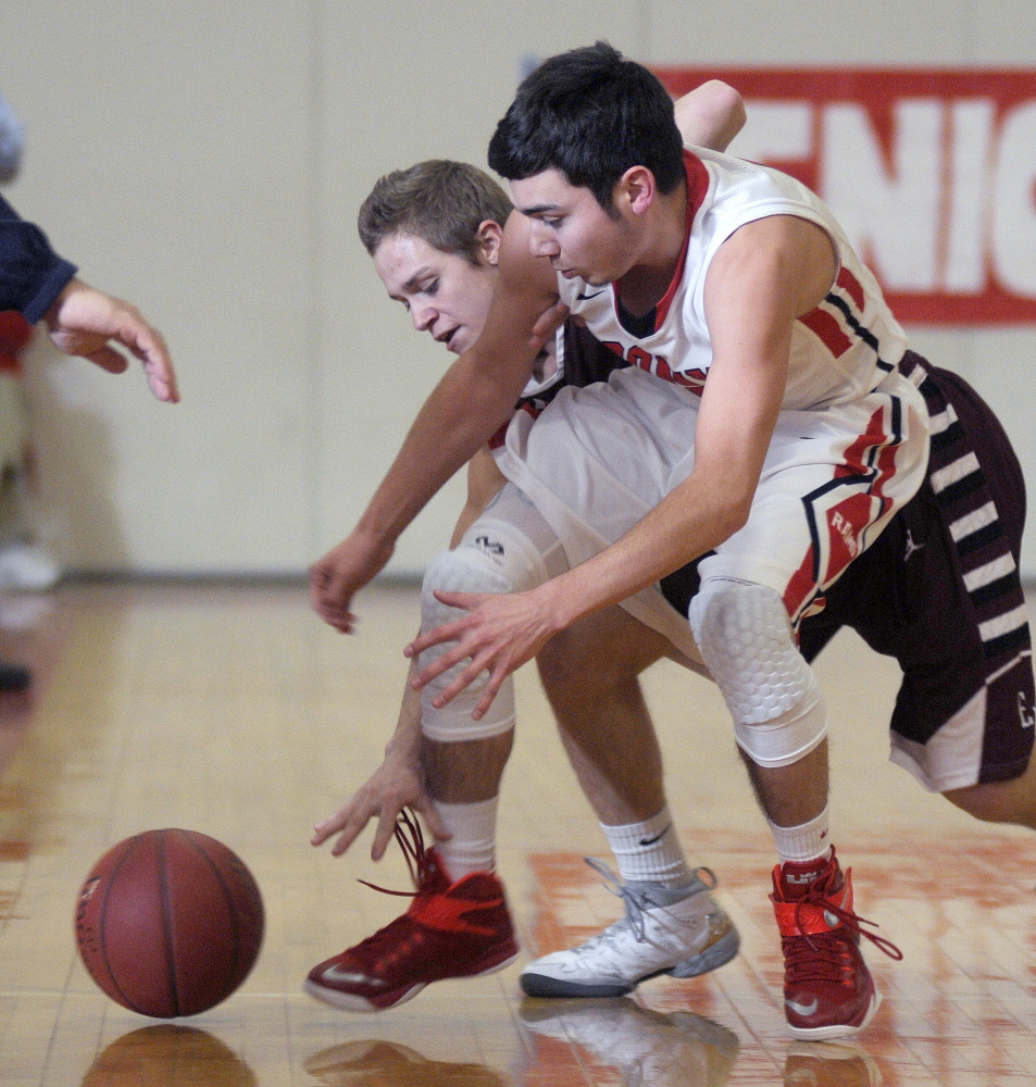 Cony’s Tyler Tardiff, right, collects a loose ball from Edward Little High School’s Luke Sterling during a Kennebec Valley athletic Conference Class A game last Tuesday in Augusta. The Rams will play Lewiston on Saturday in an Eastern A quarterfinal game.