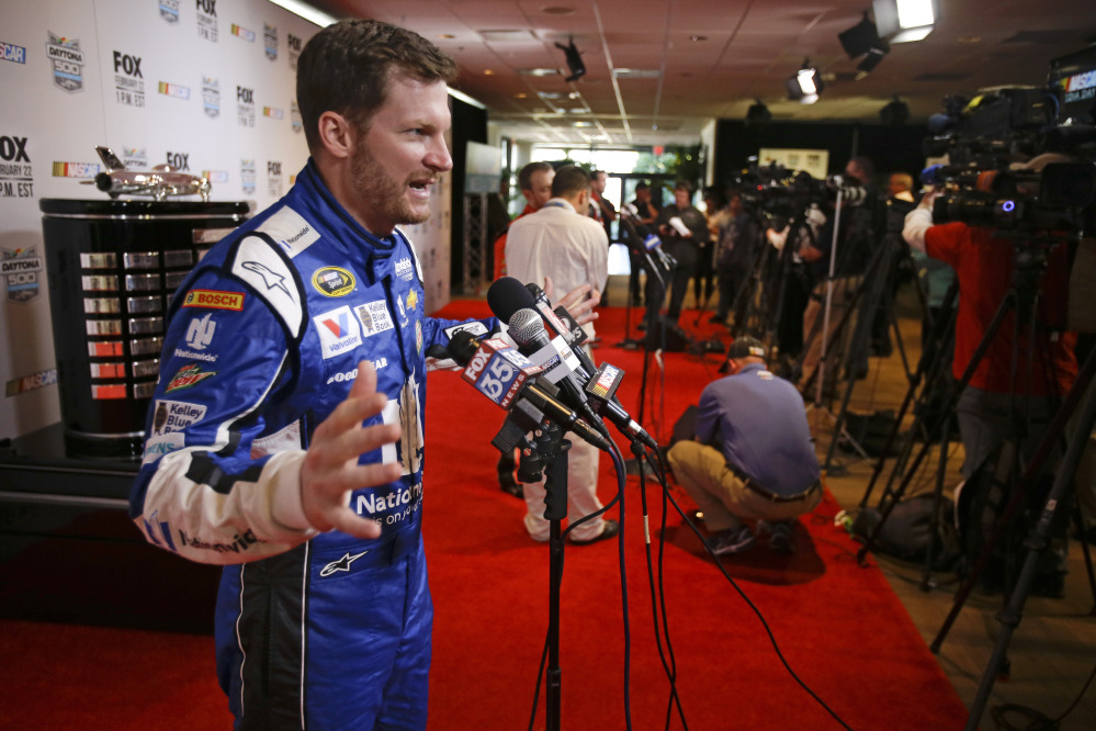 Dale Earnhardt Jr. talks with reporters Thursday during NASCAR media day at Daytona International Speedway in Daytona Beach, Fla.