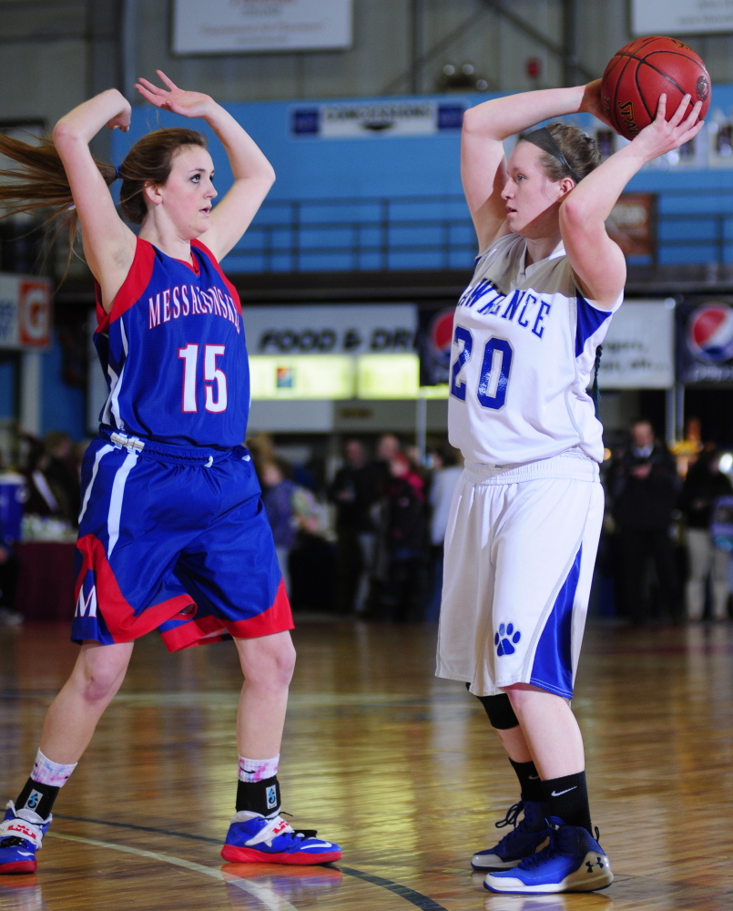 Messalonskee senior guard Halee Flewelling guards Lawrence senior guard Jordyn Towers during an Eastern A quarterfinal game Friday.