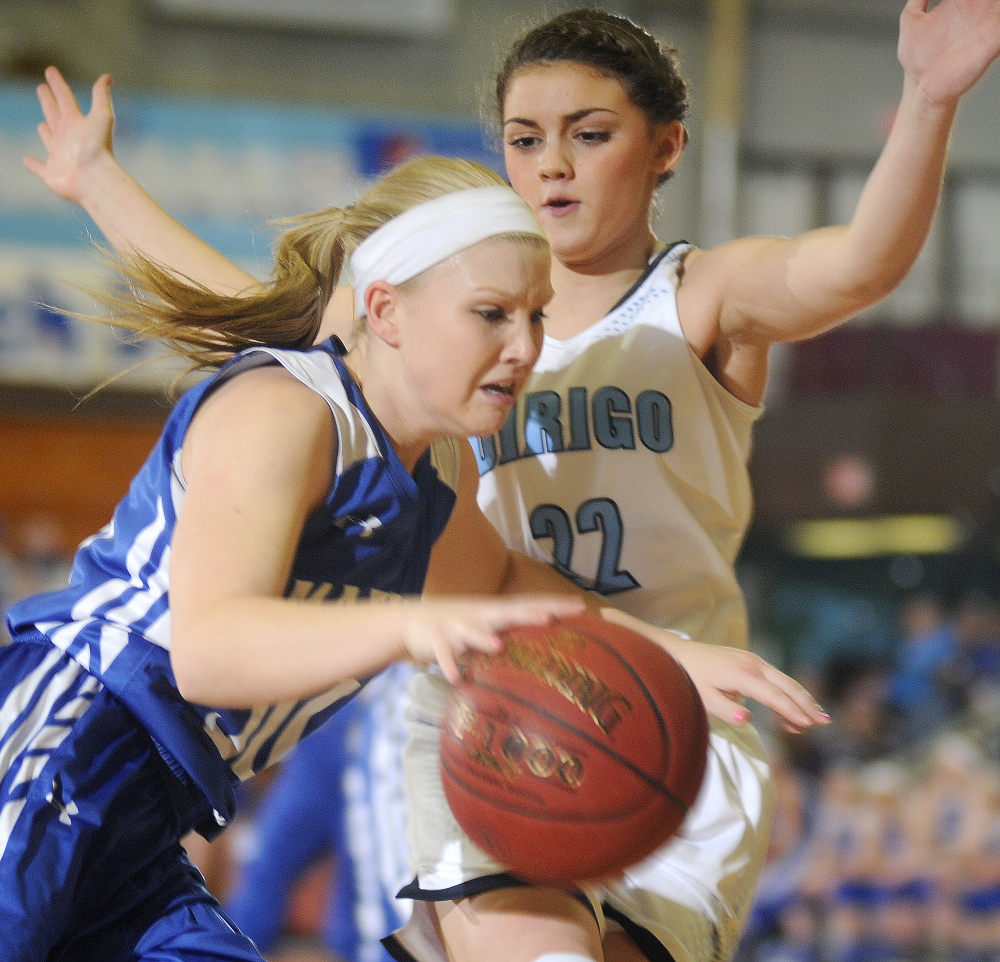 Madison’s Madeline Wood dribbles around Dirigo High School’s Olivia Noyes during a Western C semifinal Friday afternoon at the Augusta Civic Center.