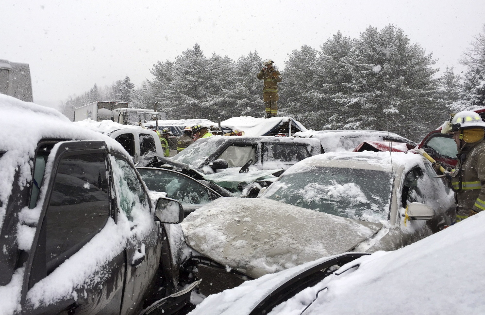 In this photo provided by Maine State Police and Maine Emergency Management, emergency personnel respond to a multi-vehicle pileup along Interstate 95 in Etna, Maine, about 20 miles west of Bangor, Wednesday, Feb. 25, 2015.  State police spokesman Steve McCausland said the pileup happened early Wednesday in heavy snow and involved many cars, a school bus and a semitrailer. No fatalities were immediately reported but McCausland said some of the injuries were serious.  (AP Photo/Maine State Police and Maine Emergency Management, Stephen McCausland)