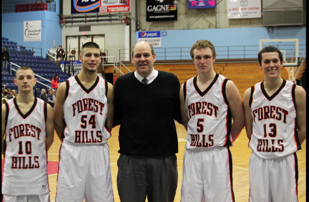 The Forest Hills boys basketball team is back in the Class D state title game. From left are Brandon Ouellette, Tanner Daigle, coach Anthony Amero, Ryan Petrin and Matt Turner.