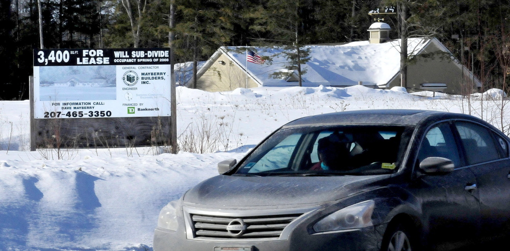 A vehicle leaving FirstPark in Oakland drives past a lot in a nearby field that is for sale on Wednesday. The director of the Kennebec Region Development Authority, which manages the park, presented his ideas for the future to the Oakland Town Council Wednesday night.