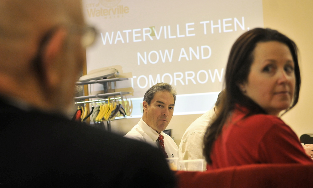 Waterville City Manager Mike Roy, center, and City Councilor Dana Bushee, right, listen to Rep. Tom Longstaff, left, on Tuesday during a joint meeting of the Waterville City Council and the city’s Board of Education in the council chambers in Waterville.