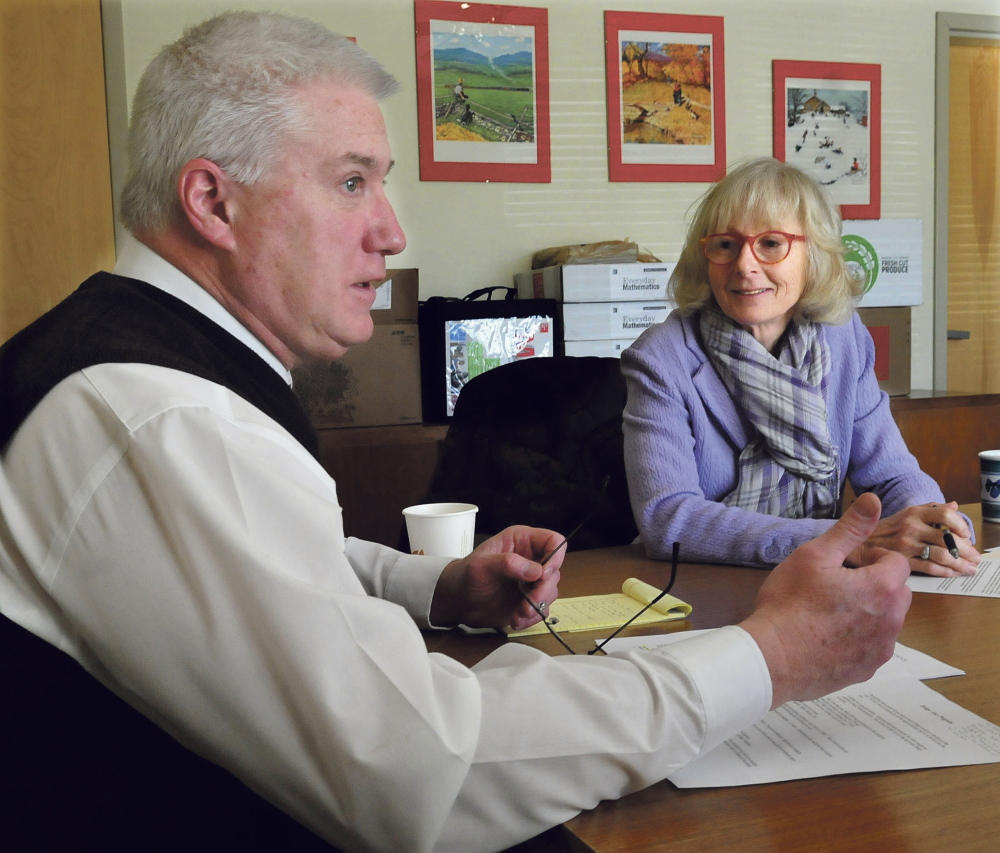 AOS 92 Assistant Superintendent Peter Thiboutot and Ann Schoenthaler-Ervin of the Coburn organization speak Thursday about the Bridge Year Program that will allow 14 Waterville Senior High School students to earn college credits at a lower cost. The charitable organization is donating $35,000 toward the program.