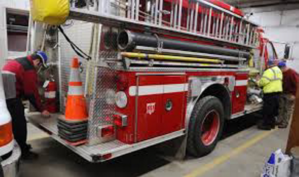 Volunteer Chesterville firefighters keep their gear in shape for the next call. State lawmakers Monday held a public hearing on legislation to provide financial incentives for volunteer firefighters.