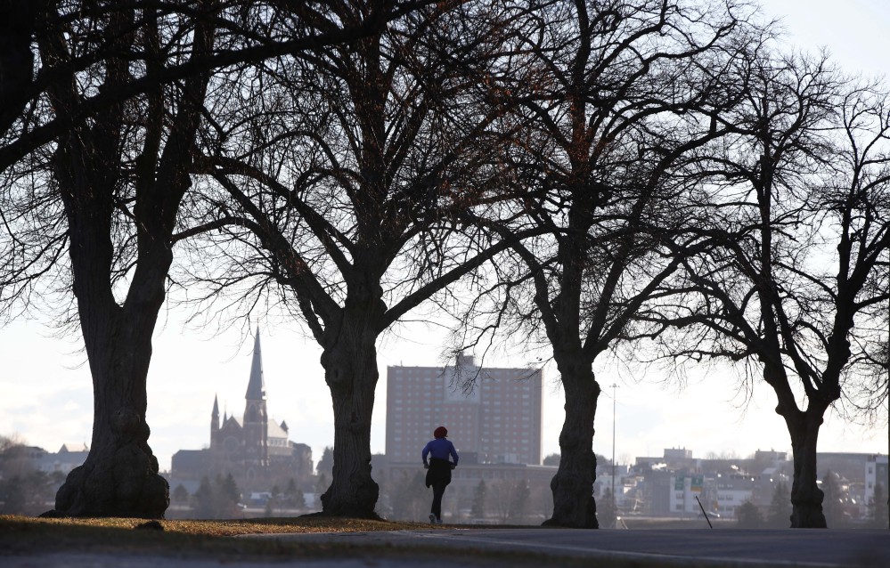 A jogger runs along the Back Cove trail in Portland in December. Health rankings in southern coastal Maine are particularly favorable compared to the national median — but the same isn’t true for the state’s rural counties.