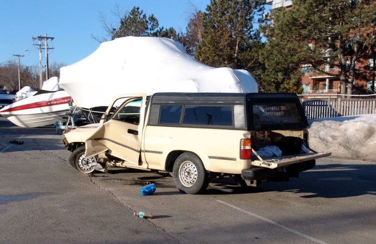 Christopher Baker, 21, of Old Orchard Beach climbed into the bed of his truck after crashing around 2 a.m. Wednesday. 