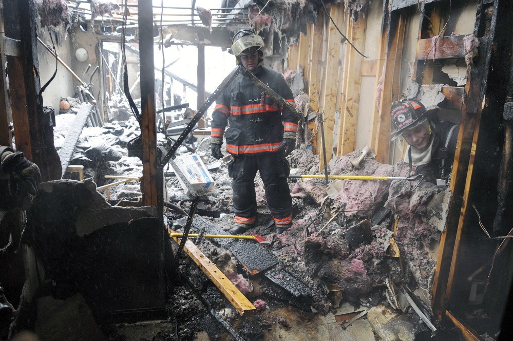 Firefighters attack the blaze at Highland Avenue Terrace on Thursday February 5, 2015, in Gardiner. Lt. Art True and firefighter/paramedics Rich Beaudoin and Dan Freeman of the Augusta Fire Department received Medals of Valor for their actions that saved people from the fire.