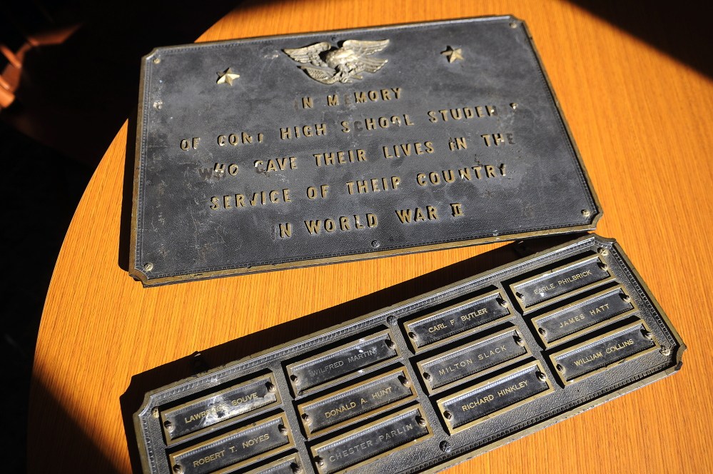 A memorial for Cony High School graduates lost in World War II at the Augusta school last week. Cony senior Kelsey Rohman is leading an effort to have the plaque displayed at the new school.