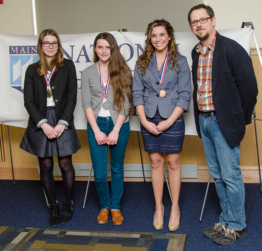 Contributed photos
Winners in the Senior Division, Individual Exhibit category, left to right, Avery Arena, Gorham High School, first place; Madeline Martin, Noble High School, second place; Sami Clark, Lawrence High School, third place; with John Taylor, Maine National History Day state coordinator.