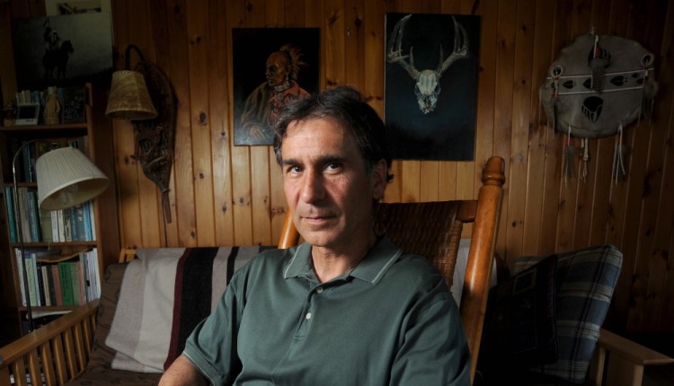 Barry Dana, of Solon, poses for a portrait in his home on May 29, 2014.