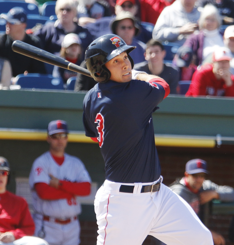 Portland left fielder Kevin Heller follows through on a swing Sunday at Hadlock Field. Heller finished 0 for 3 for the Sea Dogs, who lost their second straight game to the Reading Fightin Phils, 10-2.