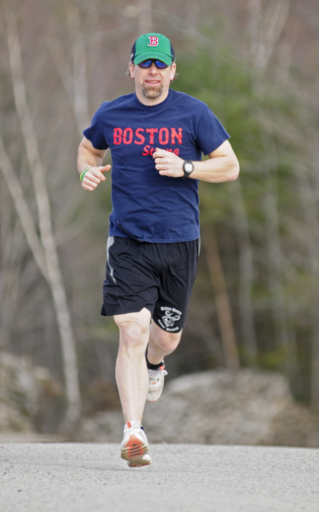 Jeff Ross goes for a run Thursday in China. Ross will be running the Boston Marathon on Monday.