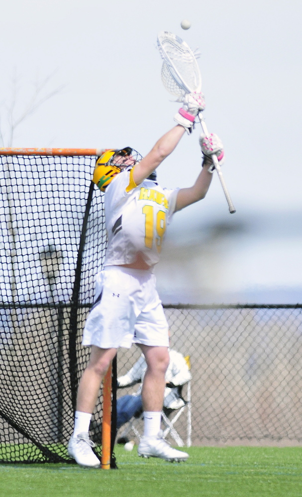 Maranacook/Winthrop keeper Isaiah Weston makes a save during a game Saturday on Huard Field at Kents Hill School in Kents Hill.