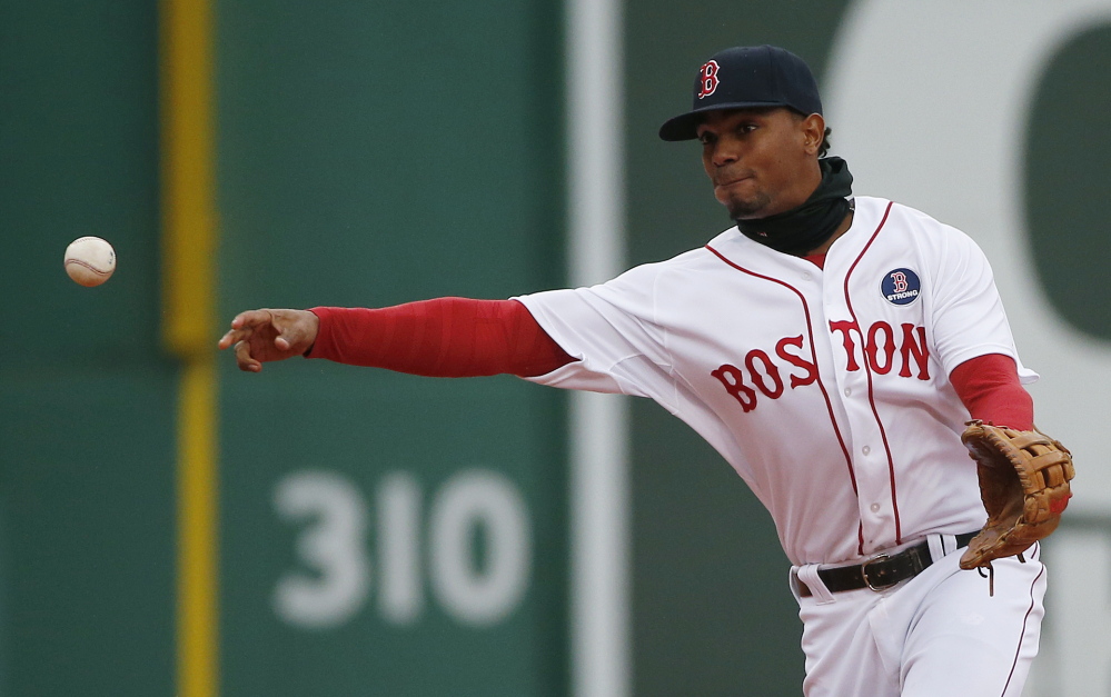 Boston Red Sox’s Xander Bogaerts throws to first base on a ground out by Baltimore Orioles’ Everth Cabrera during the second inning.