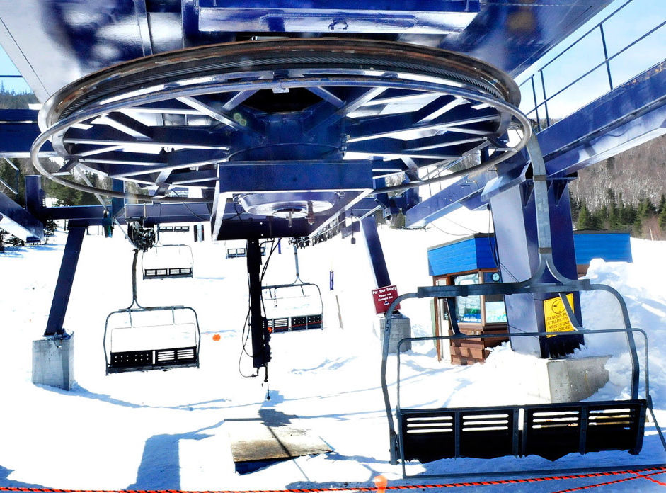 A large bullwheel sits idle above empty chairs on the King Pine chairlift at Sugarloaf Mountain Resort in Carrabassett Valley, where seven skiers were injured on March 21.