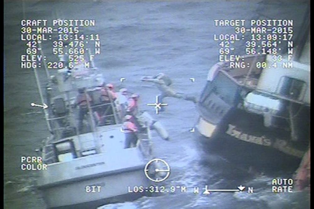 A crew member jumps from the disabled tall ship onto a U.S. Coast Guard cutter during a rescue mission 58 miles east of Gloucester, Massachusetts. Reuters