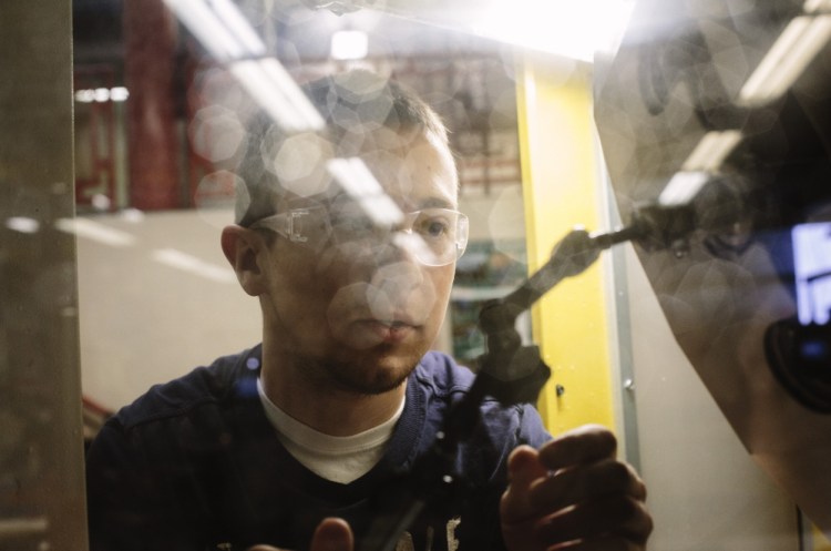 Dan Lambert, 21, works on his senior project – a clock – at the machine lab at Southern Maine Community College in South Portland last month. He’ll be graduating in May and already knows what comes next: a job at North Berwick-based Pratt & Whitney.