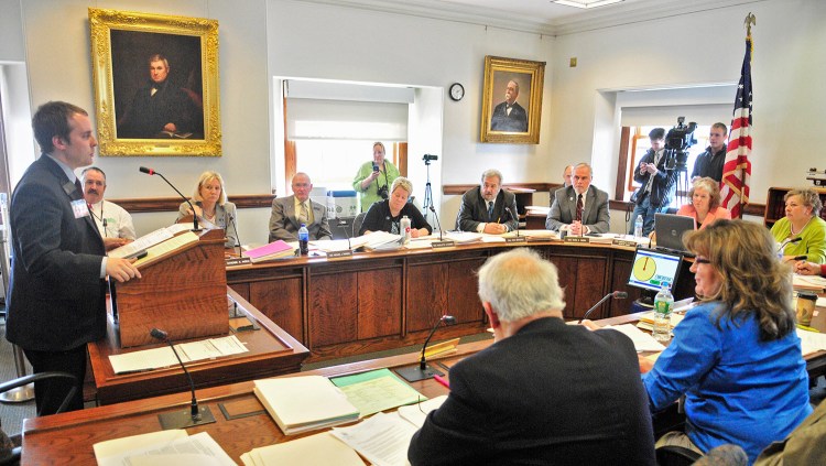 Sen. Eric Brakey, R-Auburn, introduces his bill, L.D. 652, during a hearing Wednesday by the Criminal Justice and Public Safety Committee on several gun bills. Brakey told the committee that state law now turns a legal gun owner into “a criminal” for “the simple action of putting on a jacket.”
