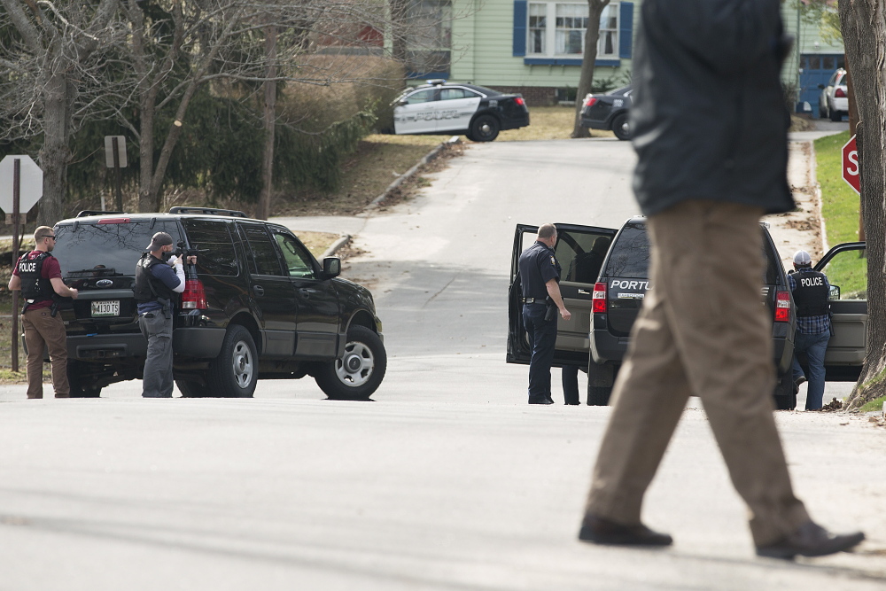 Portland police block off access at the intersection of Elizabeth Road and Frances Street after a shooting at a house there Friday. Yoon Byun/Staff Photographer