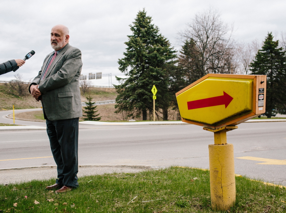 Westbrook City Councilor Paul Emery answers questions about his comment from a television reporter at the Denny’s on Congress Street in Portland on Wednesday.